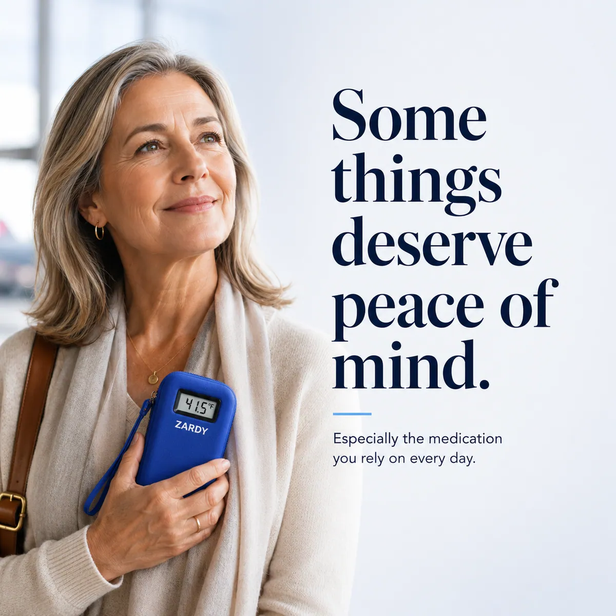 Woman holding her Zardy case close, smiling